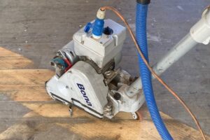 Pine floorboars during sanding
