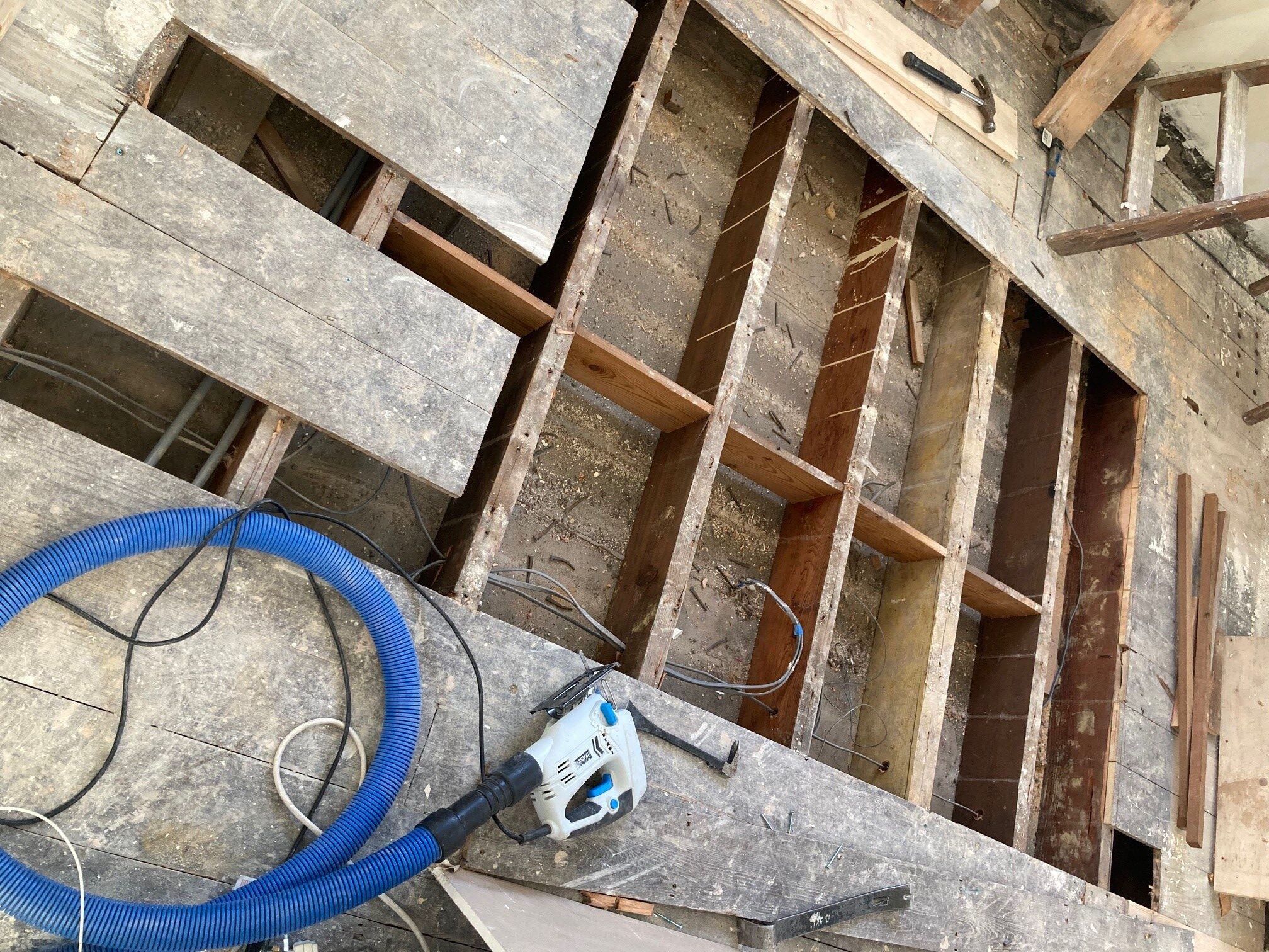 Large missing section in pine floorboards