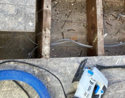 Replacing water damaged floorboards in a hallway